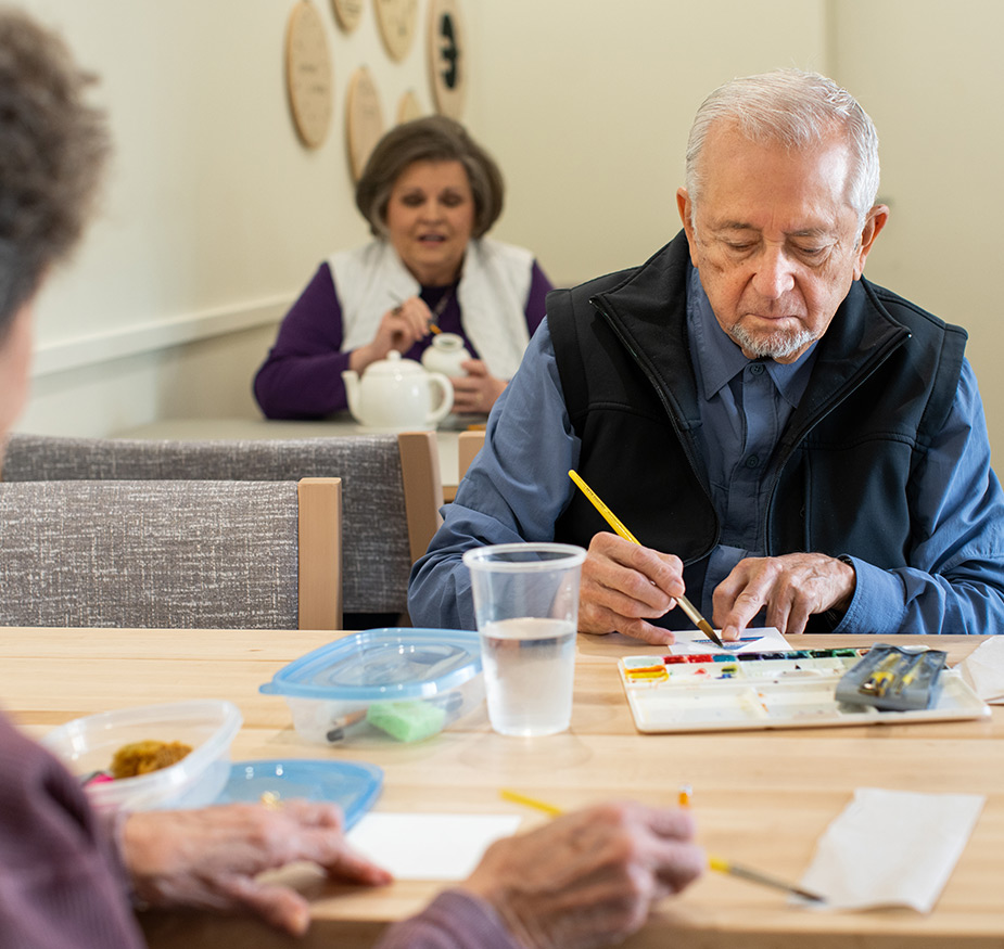 Residents painting in a art class.