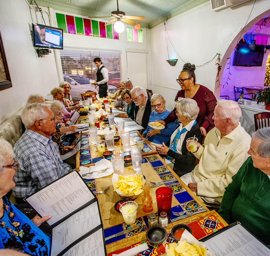 Friends out to dinner in a Mexican restaurant.