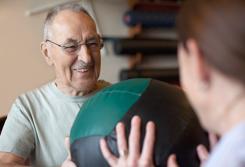 Resident working out with a caregiver.