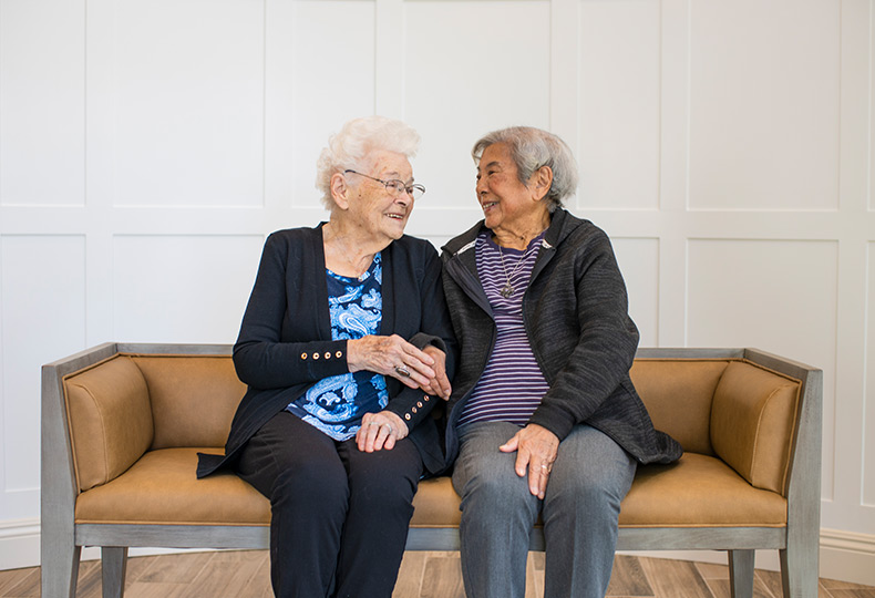 Residents chatting and sitting together on the couch