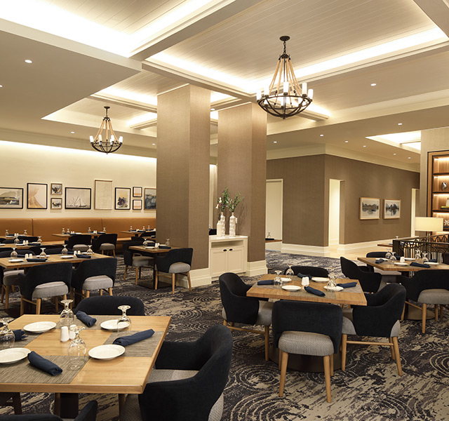 Seasons dining area with black and gray chairs.