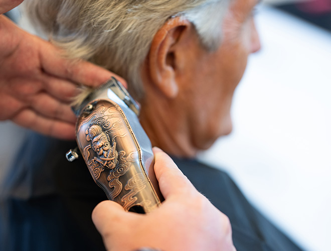 A person getting a hair cut.