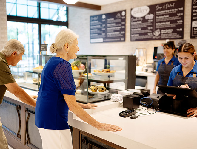 People at a deli counter.