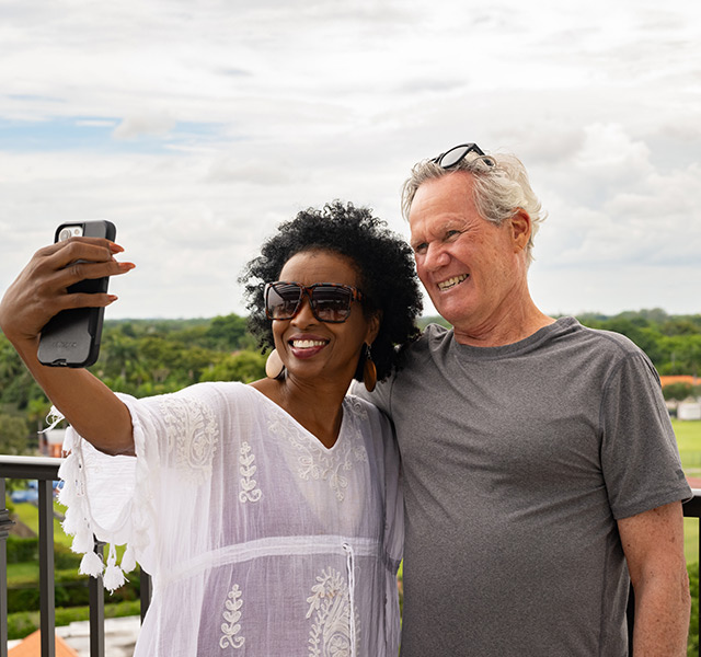 People taking a photo on the rooftop.
