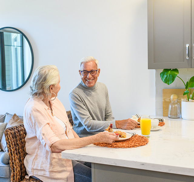 Residents having their meals in their apartment at The Watermark at Napa Valley.