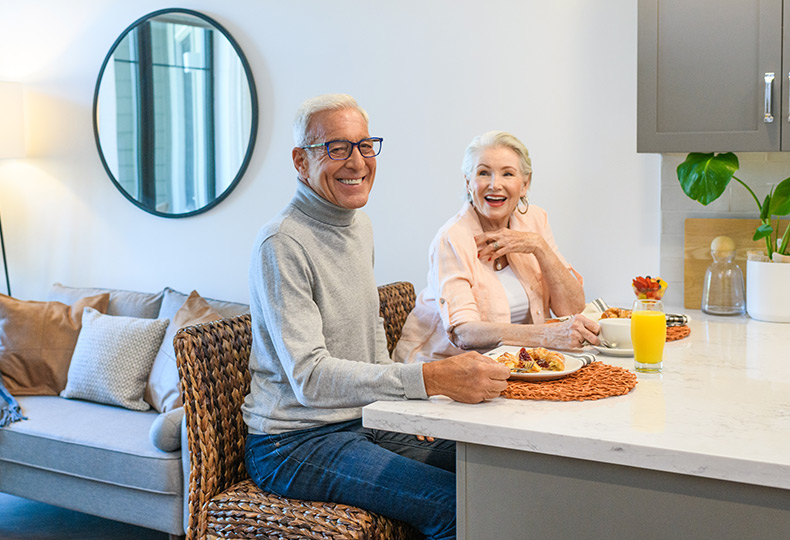 Two residents are having their meals together.