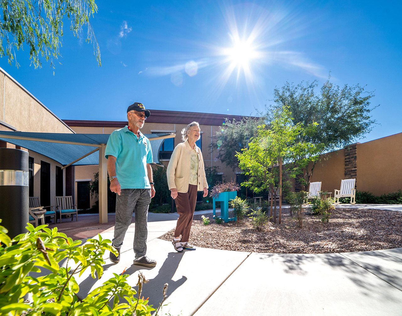 Two residents walking outside at The Watermark at Oro Valley.