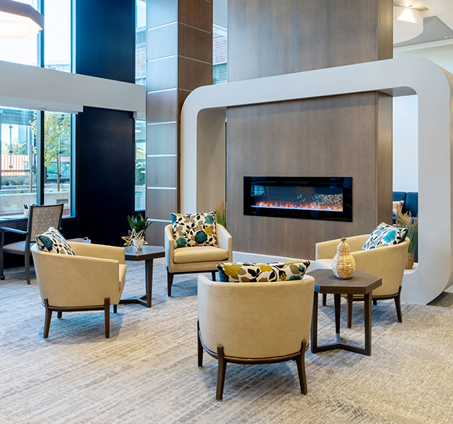A seating area with a fireplace.