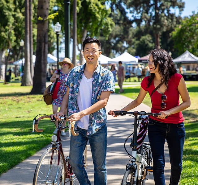 Couple on bikes.