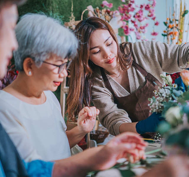People arranging flowers.