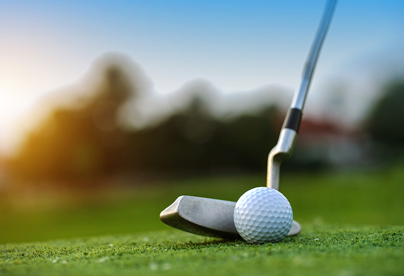 A golf club and ball.