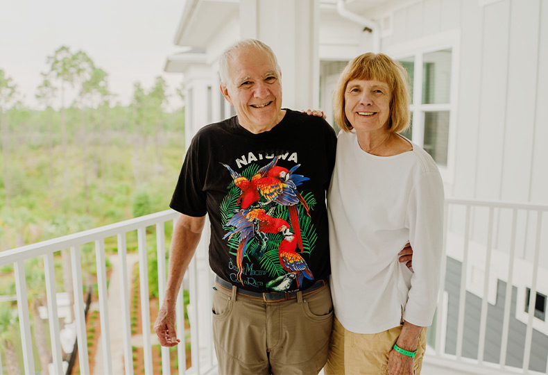 Two people smiling.