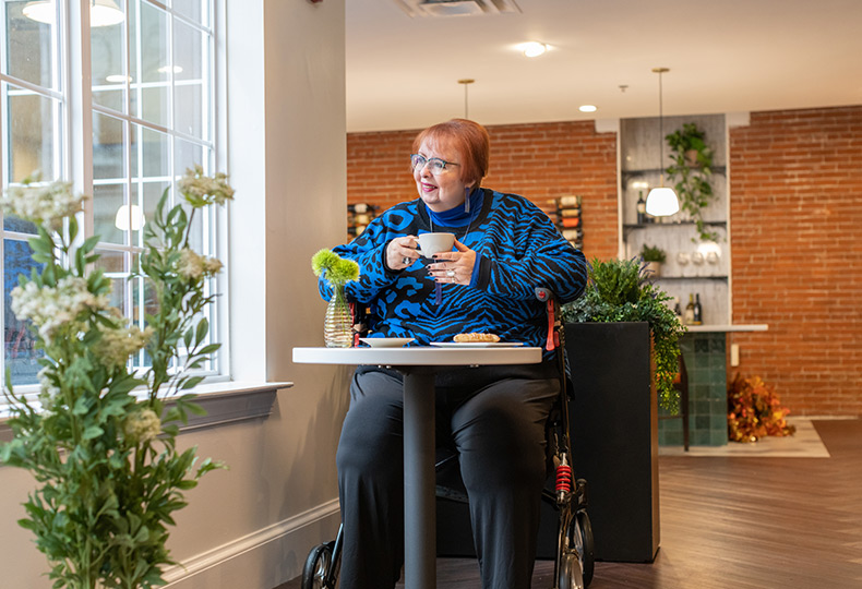A resident is having coffee.