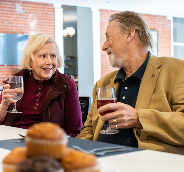 Two residents having wine at the cafe.