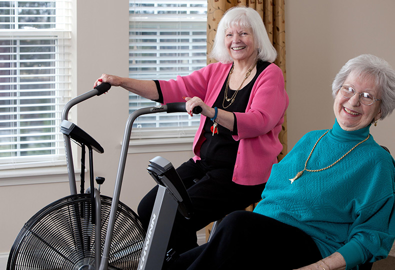 Residents enjoying fitness equipment.