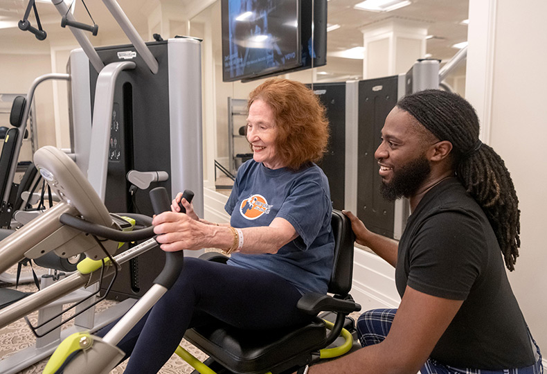 Residents enjoying fitness equipment.