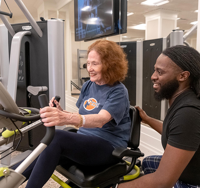 Residents enjoying fitness equipment.