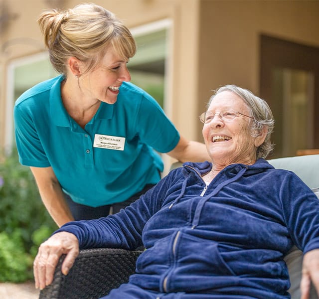 Smiling resident with an associate.