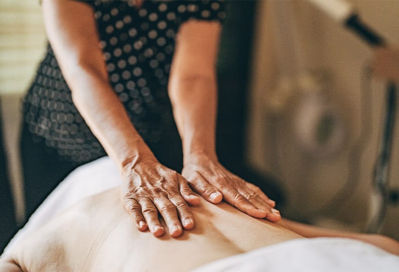 Resident enjoying a massage.