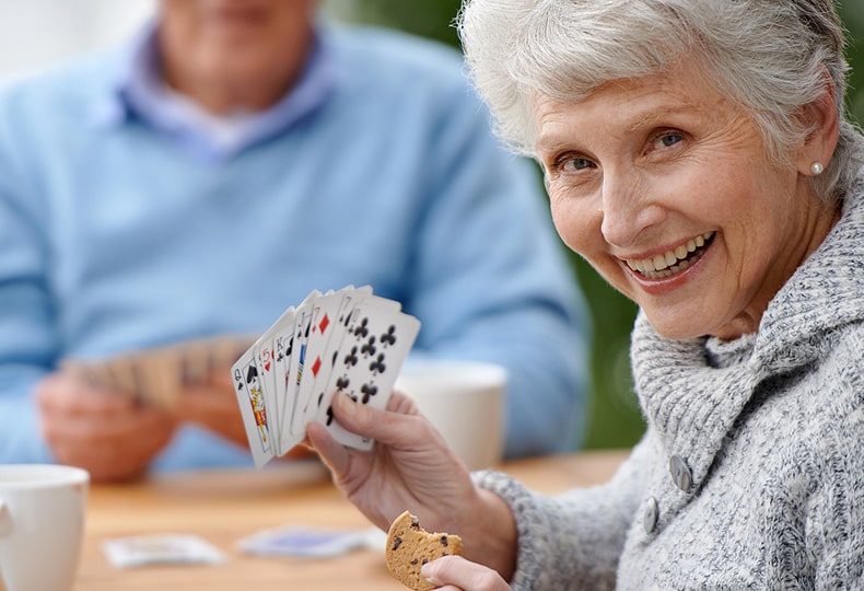 Residents playing a game of cards.