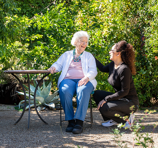 A resident with their caregiver.