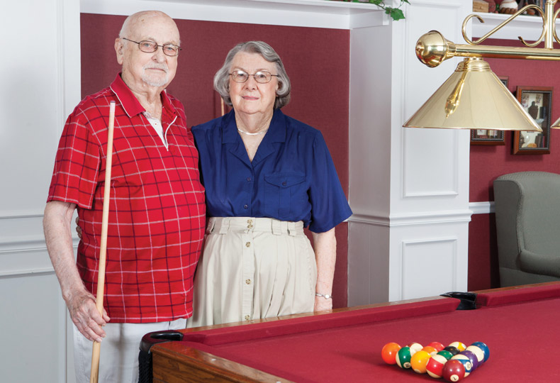 Residents playing a game of pool.