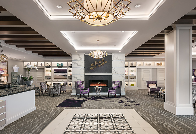 A modern lobby and lounge area fully furnished.