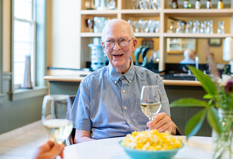 A resident having a glass of wine.
