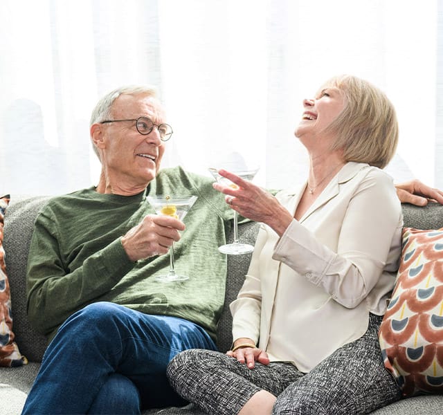 Amenities & Services Watermark at Home Two residents are having wine together.