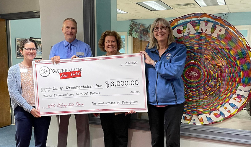 People holding a giant check.