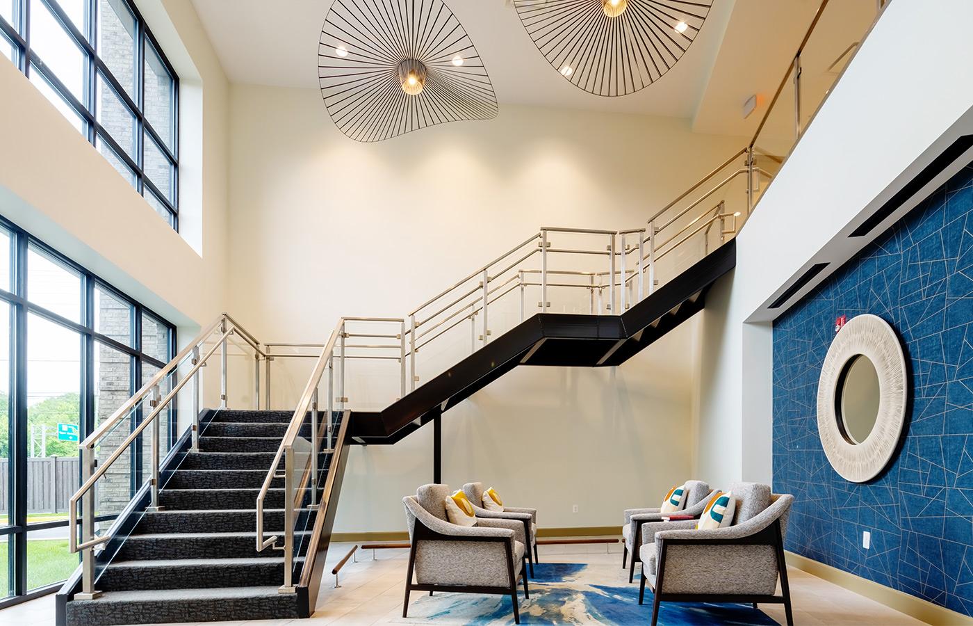 A tall modern staircase in the lobby.