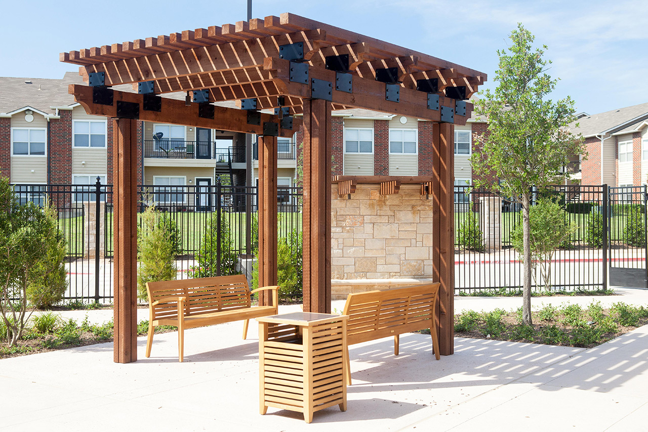 Parkview in Frisco courtyard with bench.