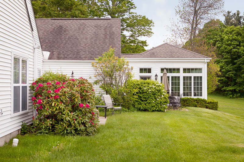 The Fountains at Millbrook white cottages on a green hillside.