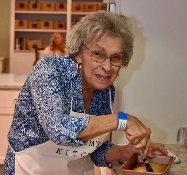 Janet Resident mixing ingredients in bowl.