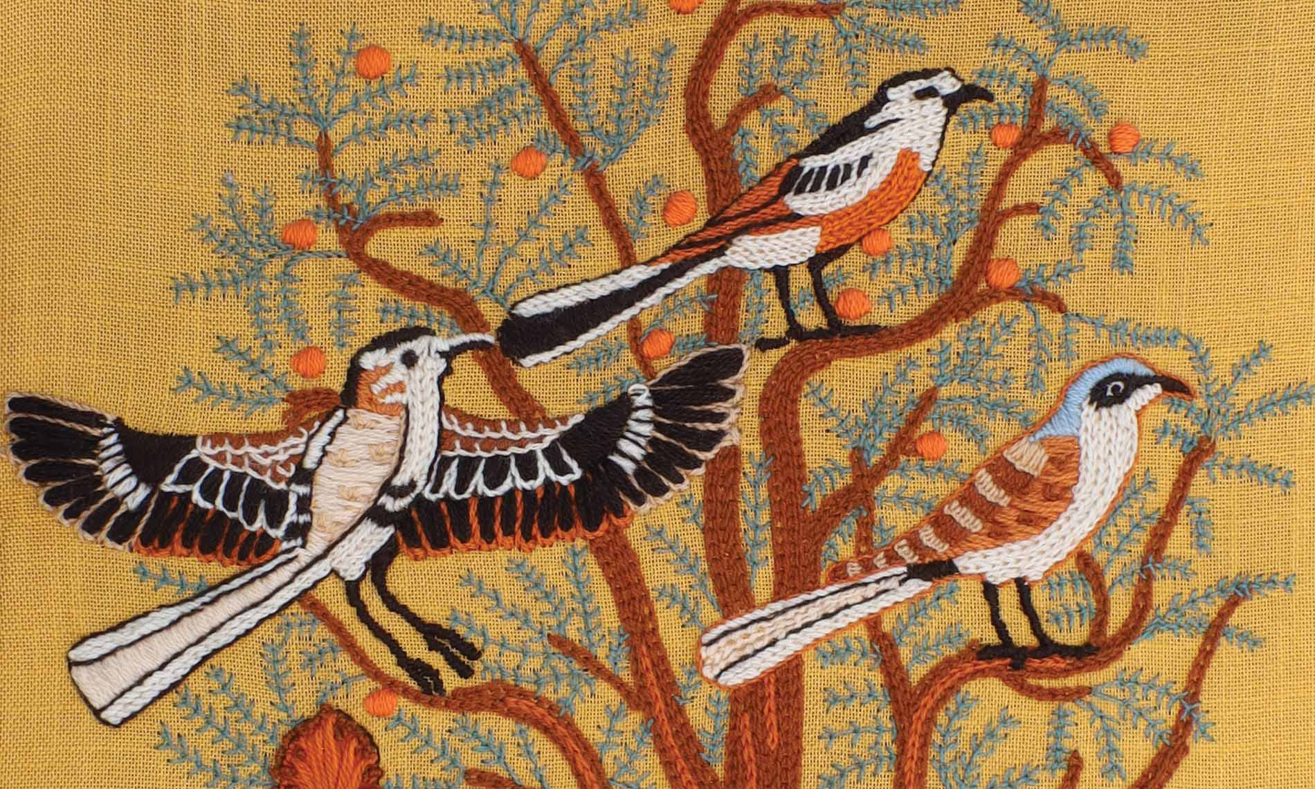 5May A piece of art of birds perched on a tree.