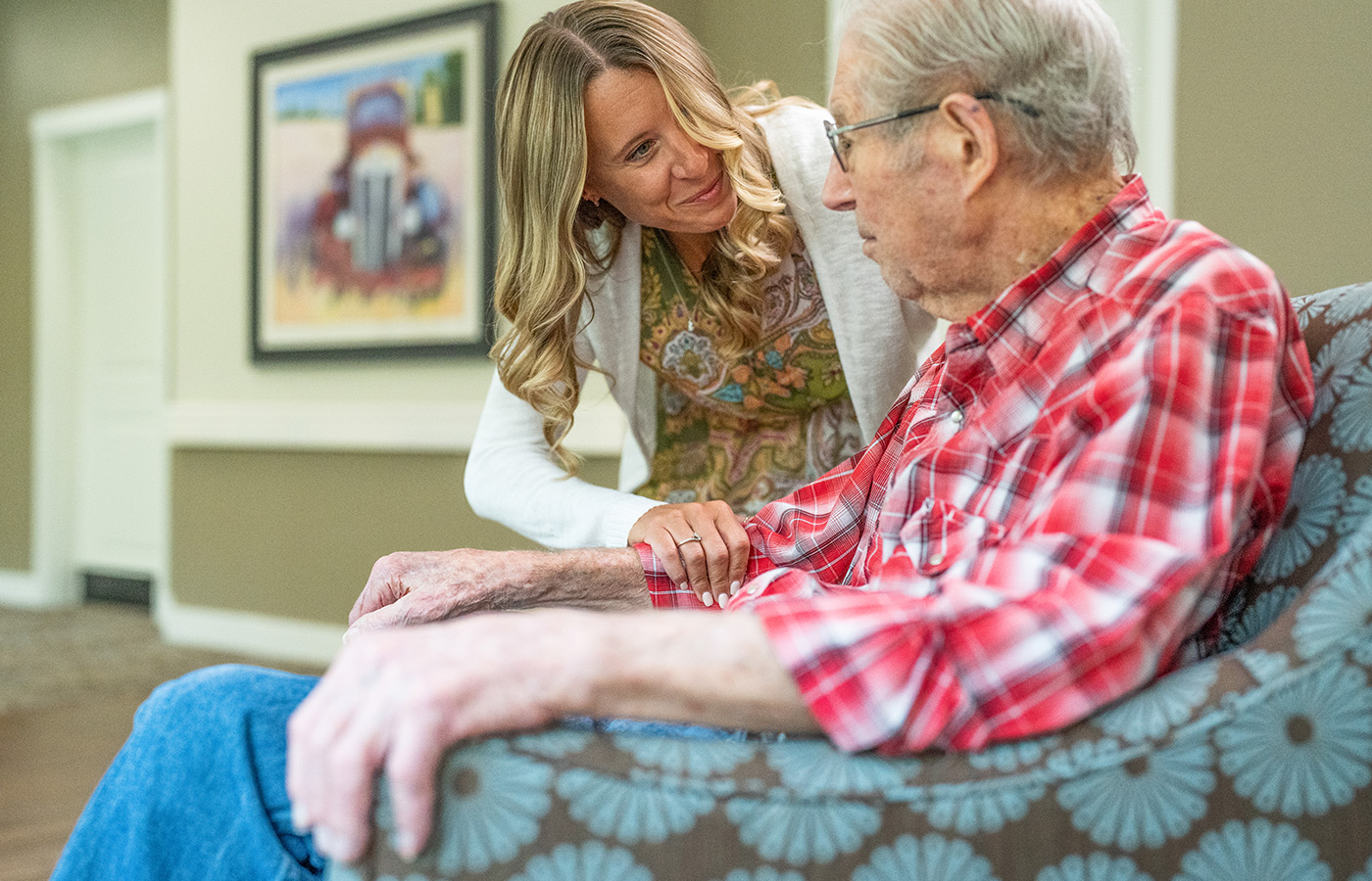 A person touching a person's arm.