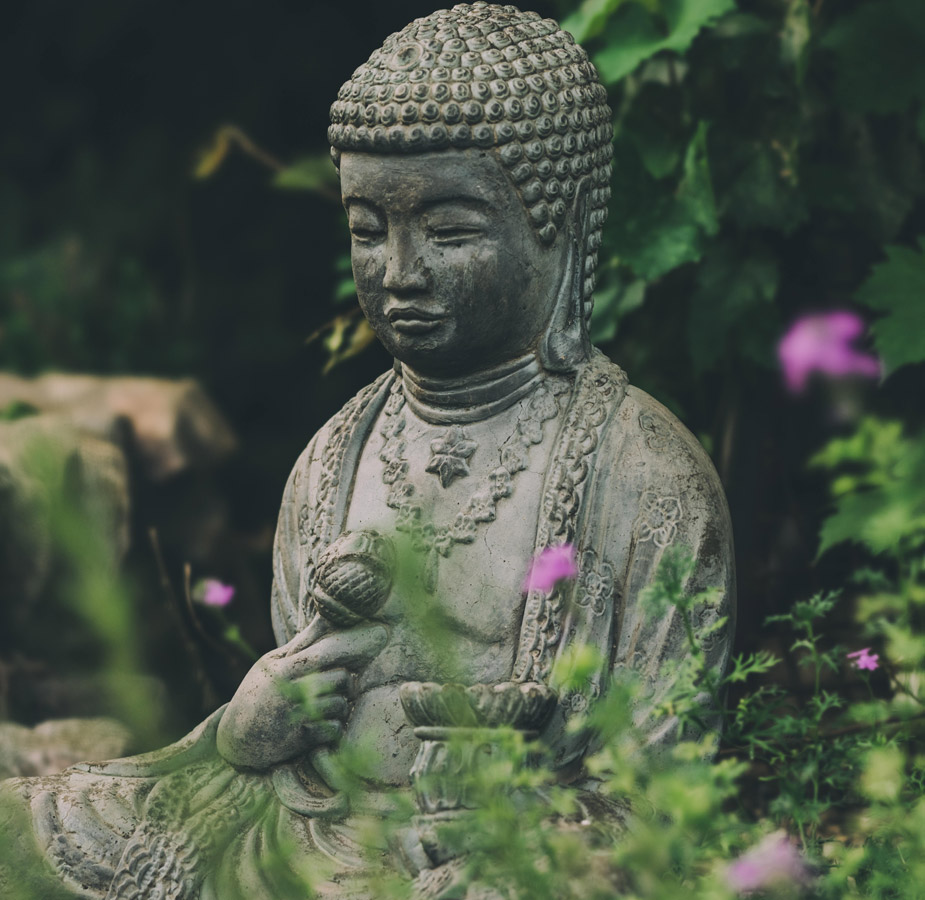 A cement statue in the gardens at The Hacienda at the Rivers