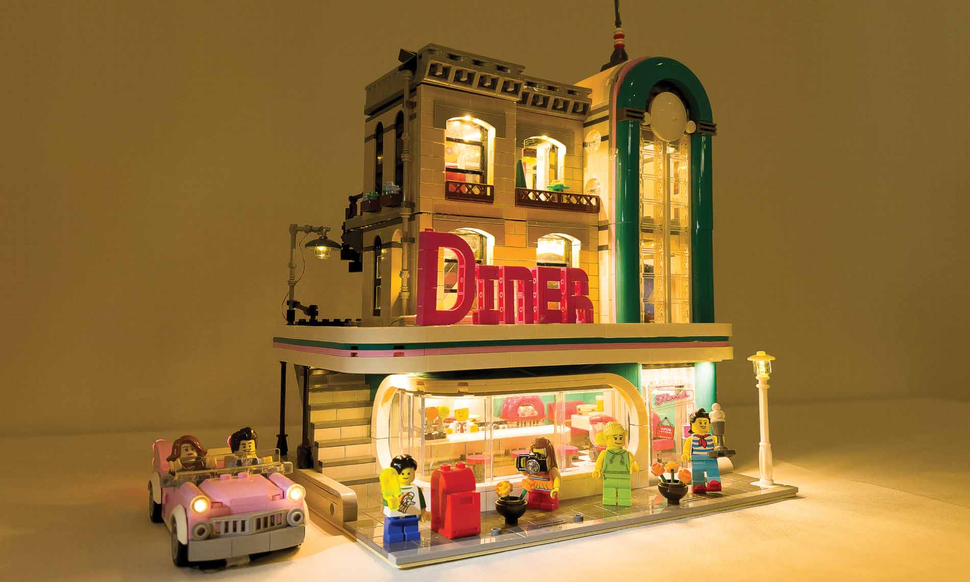 4April A 3-D art piece of a diner and pink vintage car.