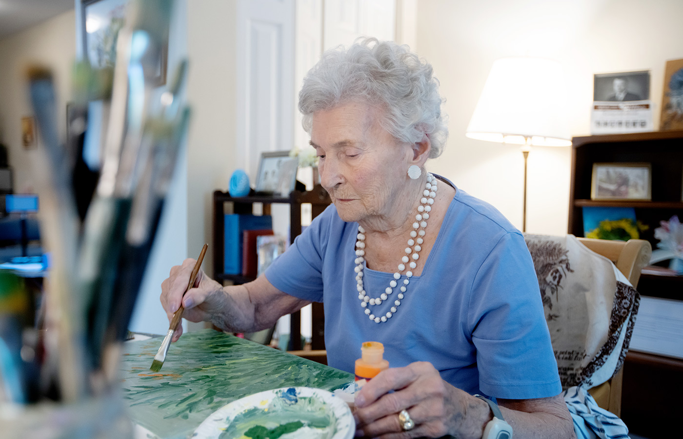 A person painting at home.