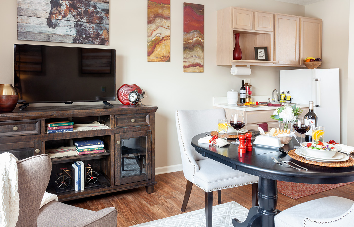 Fully furnished model apartment showing the dining and tv area.