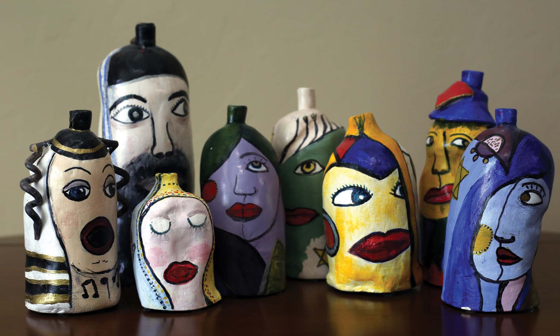 1January Multiple painted bottles of varying faces.