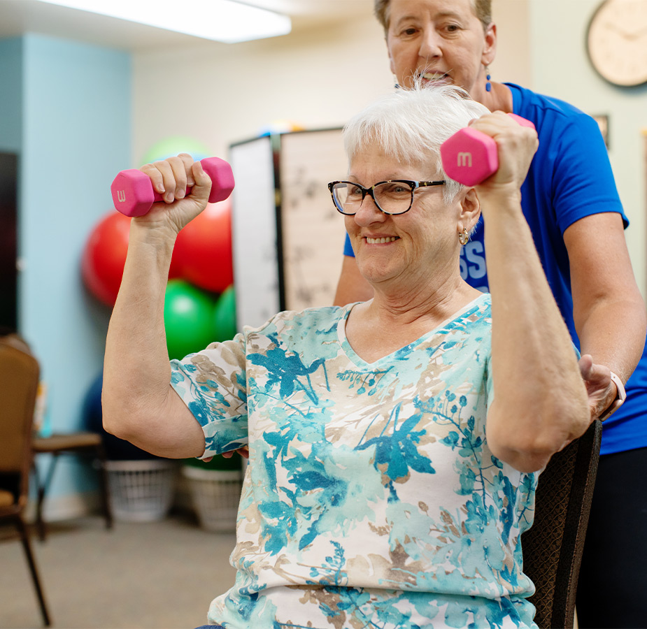 A person working out with a trainer.