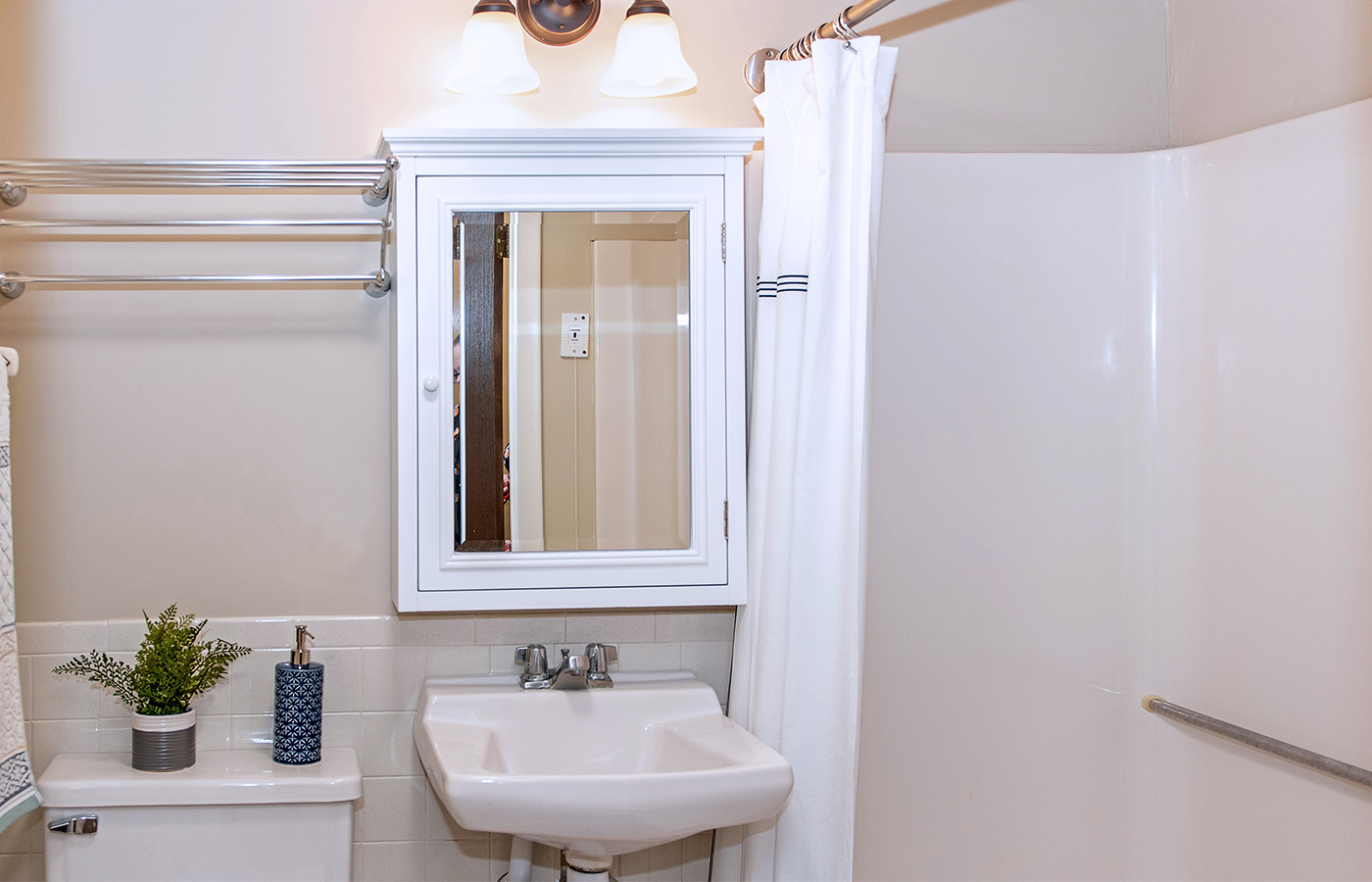 A bathroom in an apartment at The Legacy at Grand 'Vie.